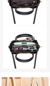 Detailed view of women black leather handbag interior with multi-layer storage compartments