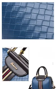 Macro shot of blue woven texture leather with brand logo and striped webbing detail