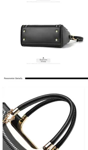 Detail view of the black leather bag base with gold feet and chain link handle accents