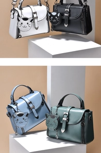 Detailed view of four colorful mini crossbody bags with cute cat-shaped coin purses