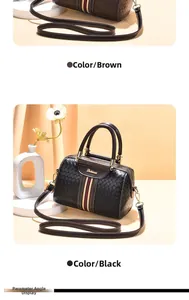 Detail of woven texture Boston bags in brown and black with signature stripe accent