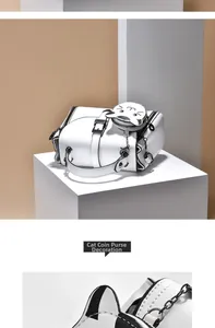 Detailed view of white PU leather handbag with a cute cat-shaped coin purse attachment