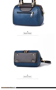 Detail view of woven leather bag showing back zipper pocket and gold bottom studs