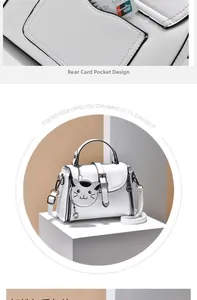 Detail of the white PU leather cat handbag featuring the rear card pocket and cute charm
