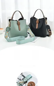 Detailed shot of two-tone bucket bags with stylish patterned wide shoulder straps