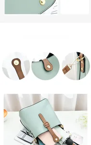 Detail of mint green bucket bag showing magnetic clasp, gold hardware and leather stitching