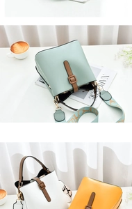 Detailed view of bucket bags in pastel green, white, and yellow with printed wide straps