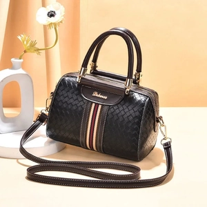Classic black woven texture pillow bag with colorful stripes and gold logo detail