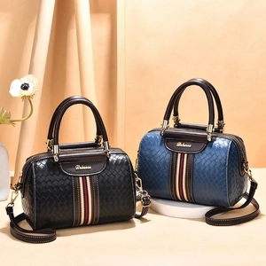 Classic woven texture Boston bag in black and navy with striped contrast and gold hardware