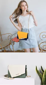 Detail of color-block crossbody bag with geometric flap and Romantic Paris embossing