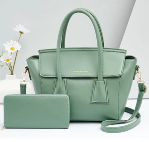 Sage green tote bag set with matching long zipper wallet featuring gold logo detail