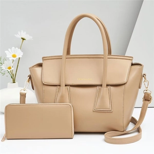 Beige faux leather handbag and wallet set with elegant gold hardware for women