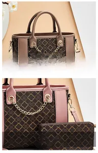 Close-up of PU leather handbag set with clover pattern and gold chain hardware detail
