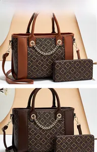 Detail of brown monogram PU leather tote bag and wallet set with gold chain and strap
