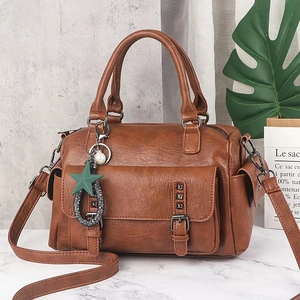 Brown leather Boston bag with vintage texture and stylish star pearl pendant handle