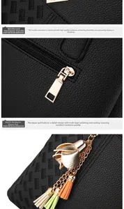 Détails des finitions dorées et texture du cuir avec pompon décoratif sur sac à main