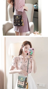 Detailed close-up of mini crossbody phone bags with bear charms and monogram patterns
