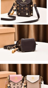 Detail of mini crossbody phone bags with adjustable straps and cute doll pendants