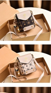 Detail of mini crossbody phone bags with monogram pattern and cute cartoon charm