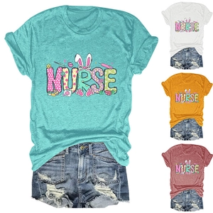 Detail of multi-color Easter nurse shirts featuring bunny ears and medical graphics