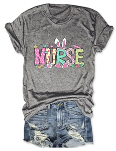 Detail of grey Nurse T-shirt with Easter bunny graphics and distressed denim shorts