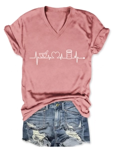 Detail of pink V-neck T-shirt with Rx heartbeat print paired with ripped denim shorts