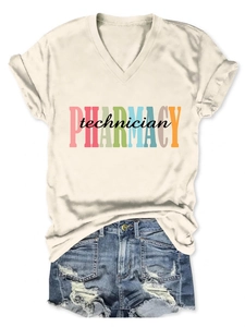 Flat lay of v-neck pharmacy technician cotton t-shirt with ripped denim shorts