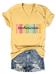 Detail of V-neck pharmacy technician t-shirt paired with ripped denim shorts on white background