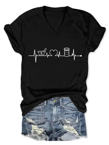 Detail of V-neck T-shirt with Rx medical heartbeat print and frayed denim shorts