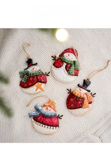 Detailed set of four painted metal Christmas snowman ornaments on white knit fabric