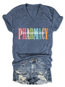 Detailed flat lay of blue V-neck pharmacy technician T-shirt with denim shorts