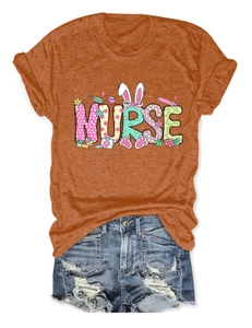 Detail of vibrant orange Easter Nurse T-shirt with bunny ears and distressed denim shorts