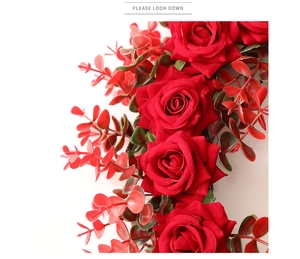 Close-up of artificial red roses with eucalyptus leaves for Valentine decoration