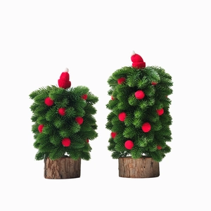Mini Christmas tree set with red hats and wooden base for festive tabletop decoration
