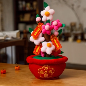 Detail of red festive bonsai with plush pink flowers and golden prosperity tags