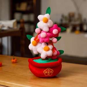 Detail of plush Lunar New Year orange tree decor with embroidery and floral elements