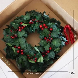 Detailed view of a 40cm Christmas wreath with red berries and size dimensions in a box