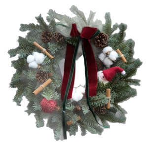 Christmas wreath with pine cones, cotton, and snowman on white background