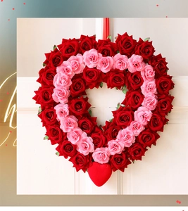 Detail of red and pink heart-shaped rose wreath with layered petals for festive decoration