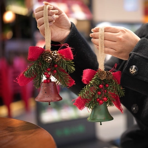 Handheld rustic Christmas bell ornaments with pine cones and red burlap bows decoration