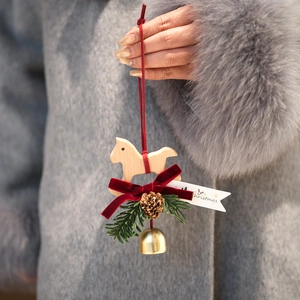 Wooden rocking horse Christmas car pendant with velvet bow, pine cone, and bell
