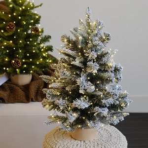 Mini sapin de Noël enneigé pour table avec lumières LED et base ronde en bois naturel