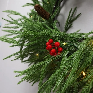 Close-up of 2.7m PE willow leaf garland with warm LED lights, red berries and pine cones
