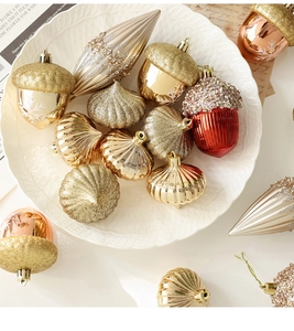 Close-up of champagne and burgundy Christmas ornaments with diverse shapes and textures