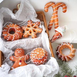 Christmas gingerbread man and snowflake foam ornaments set in a decorative basket