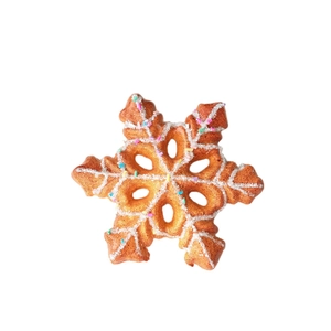 Golden snowflake ornament with white frosting and colorful sprinkles for Christmas