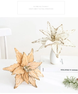 Detail of glitter-edged Christmas poinsettia flowers in elegant white and champagne tones