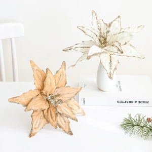 Champagne and white artificial Christmas flowers with glitter on velvet petals
