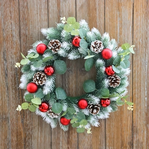 40cm Christmas wreath with eucalyptus leaves, pine cones, and red baubles on wood