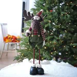 Sitting Christmas reindeer plush doll in plaid shirt and green suspenders with long legs